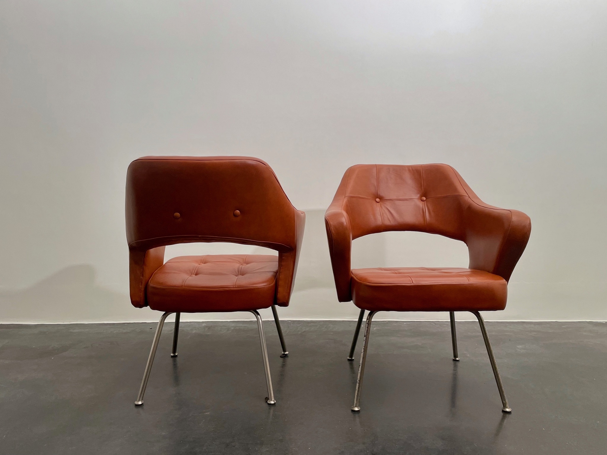 Pair of leather armchairs by Gastone Rinaldi