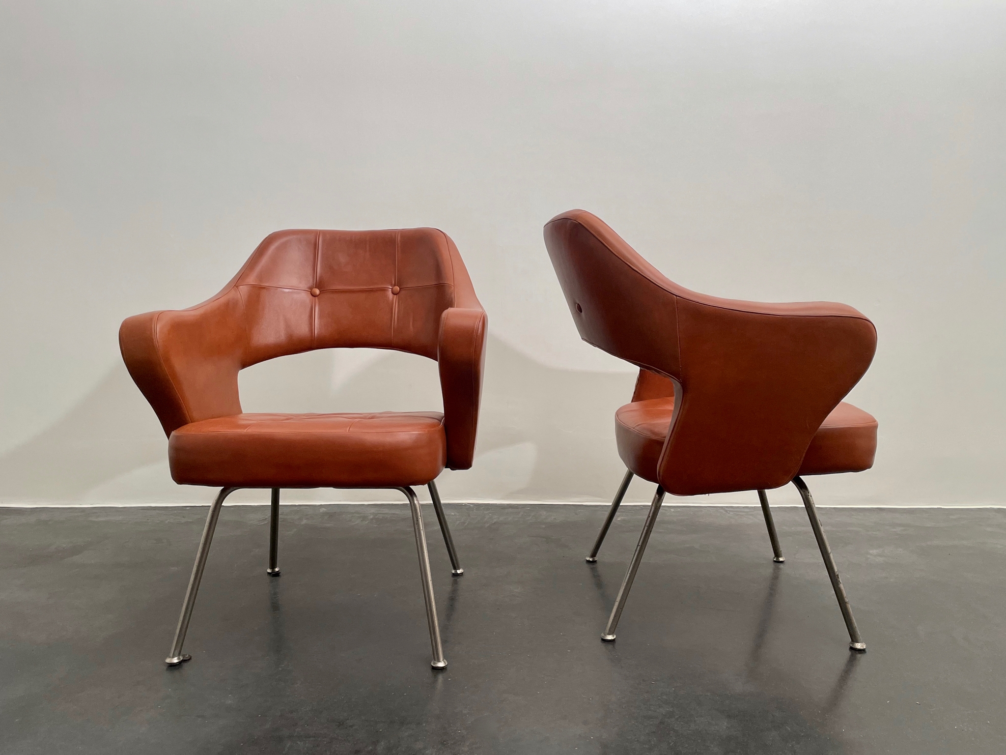 Pair of leather armchairs by Gastone Rinaldi